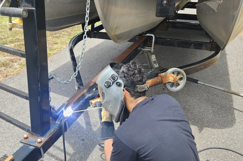 Man With Visor Welding On Metal